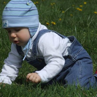 toddler, on the grass, blue cap