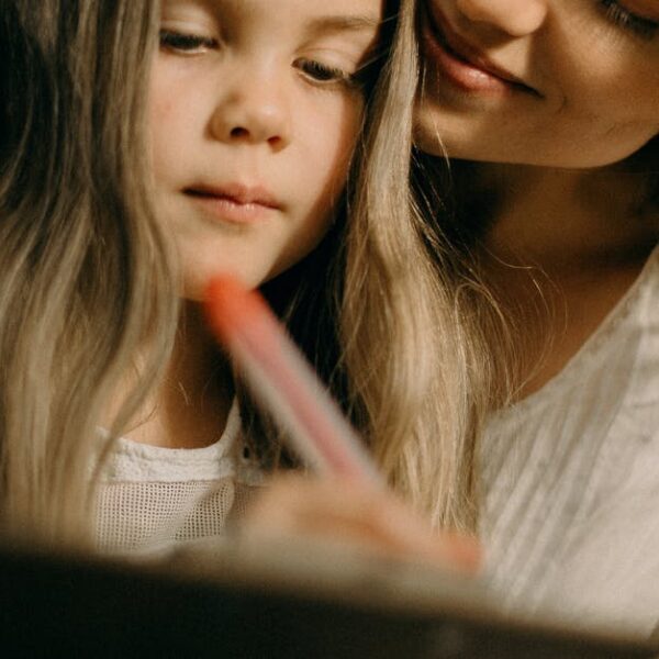 Girl Writing on the Paper Photograph