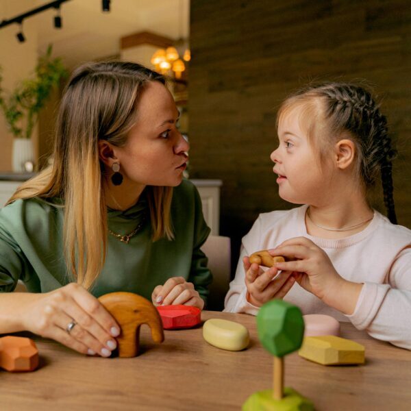 A Woman and Girl Playing Together