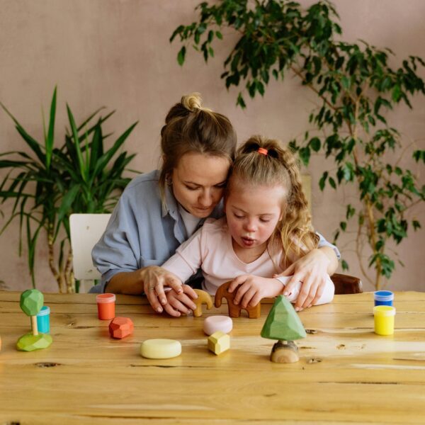 A Woman and Girl Playing Together